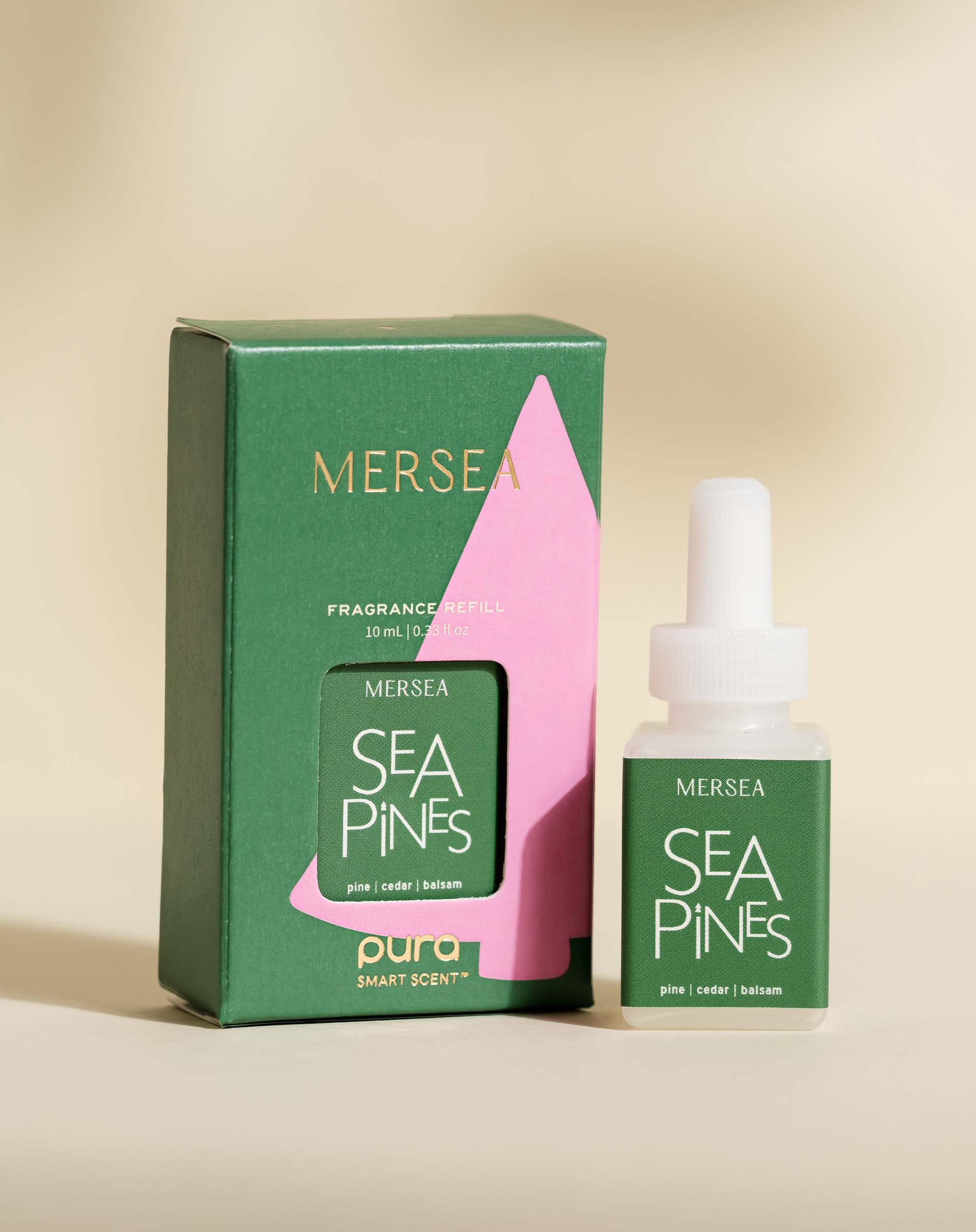pura smart vial of mersea sea pines scent sitting next to boxed version of same product