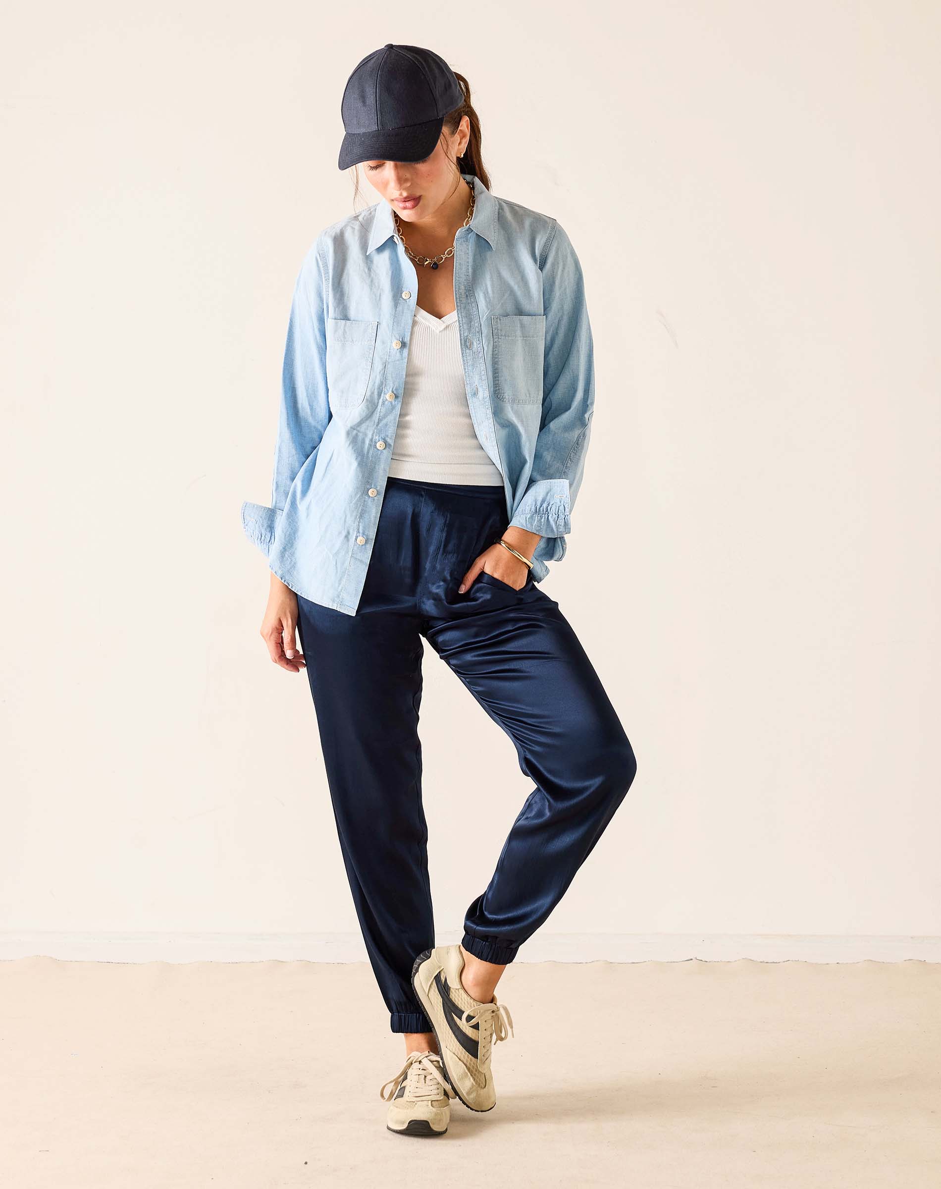 Navy satin jogger pants with a relaxed fit and elegant sheen.