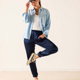 Navy satin joggers featuring a relaxed fit and gathered ankles.