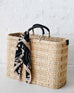 Large Medina market basket with black handles and details and navy and black and sand scarf wrapped around the handle