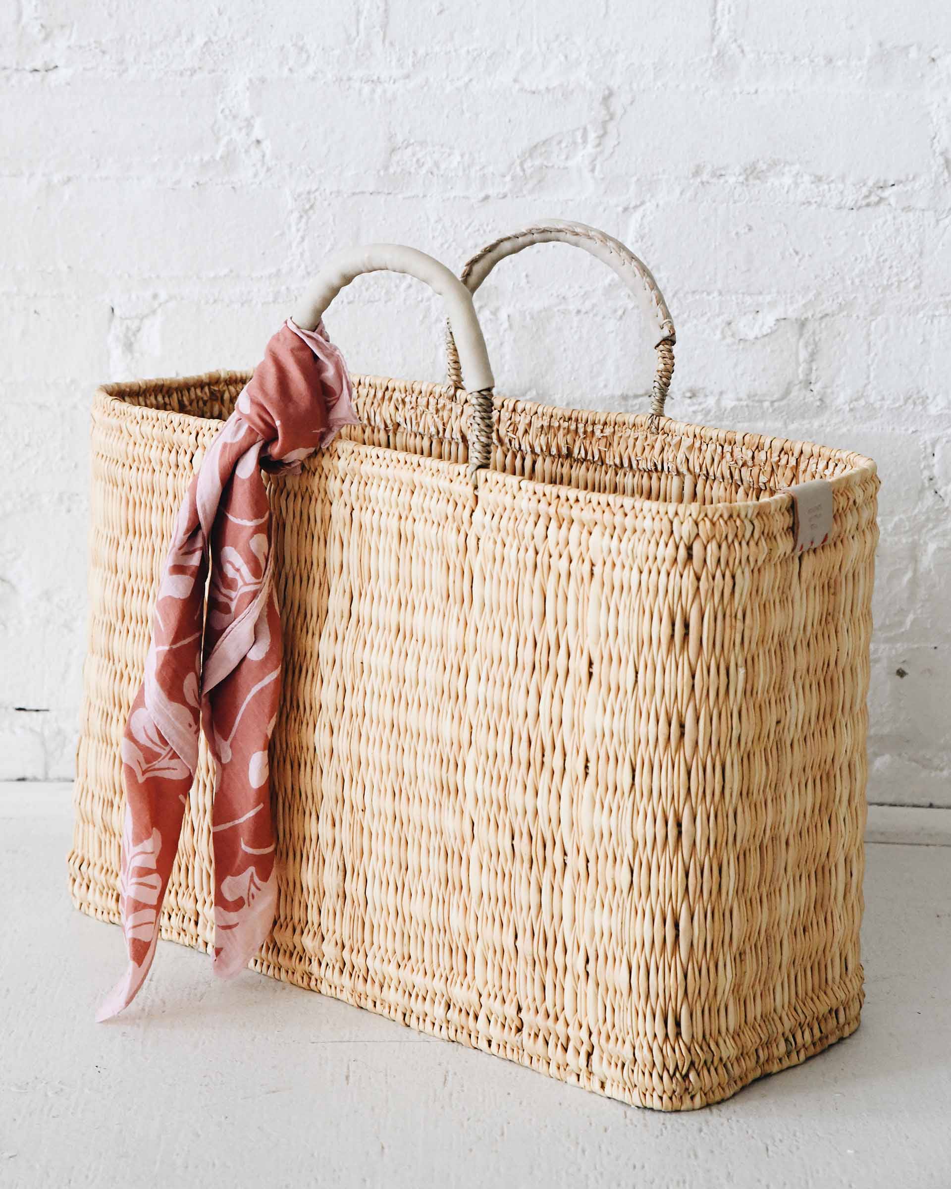 Large Medina market basket with off-white handles and details and pink scarf wrapped around the handle