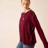 Burgundy barbie cashmere knit sweater with a relaxed boyfriend fit and unique white contrast stitching along the seams.