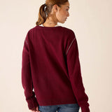 Back view of the burgundy boyfriend cashmere sweater featuring a relaxed fit and ribbed cuffs.