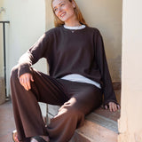 Women's travel-friendly truffle brown oversized cashmere sweater with a relaxed fit and knit texture.