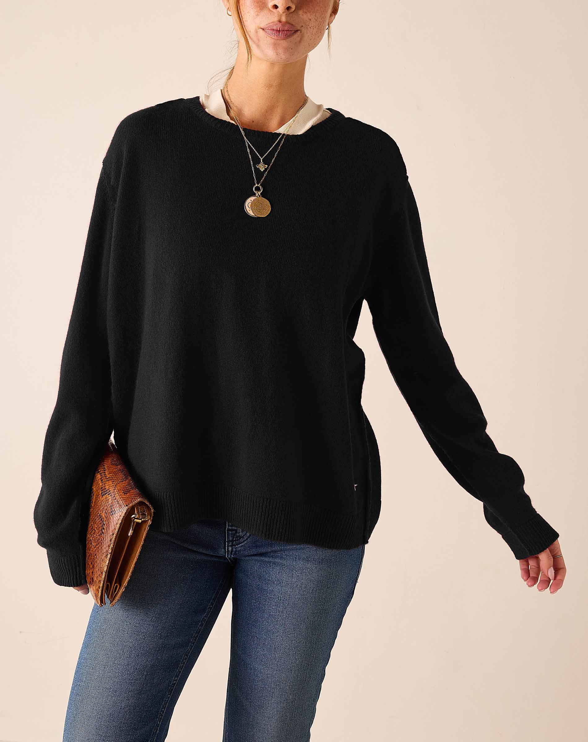 MERSEA women's travel-friendly black oversized boyfriend knit sweater with a wide ribbed neckline and relaxed fit.