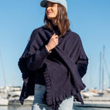 Women's travel-friendly navy blue ruffled wrap in a soft knit fabric.