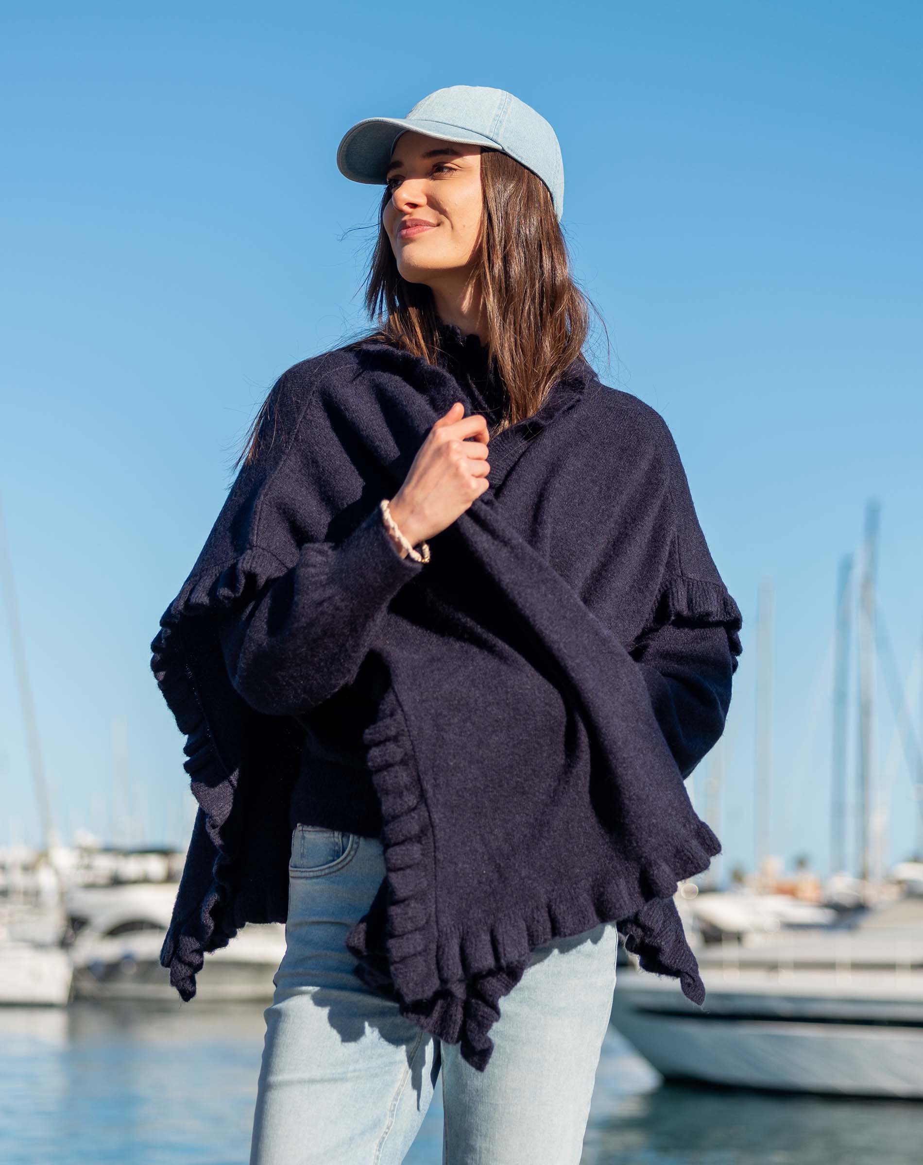 Women's travel-friendly navy blue ruffled wrap in a soft knit fabric.