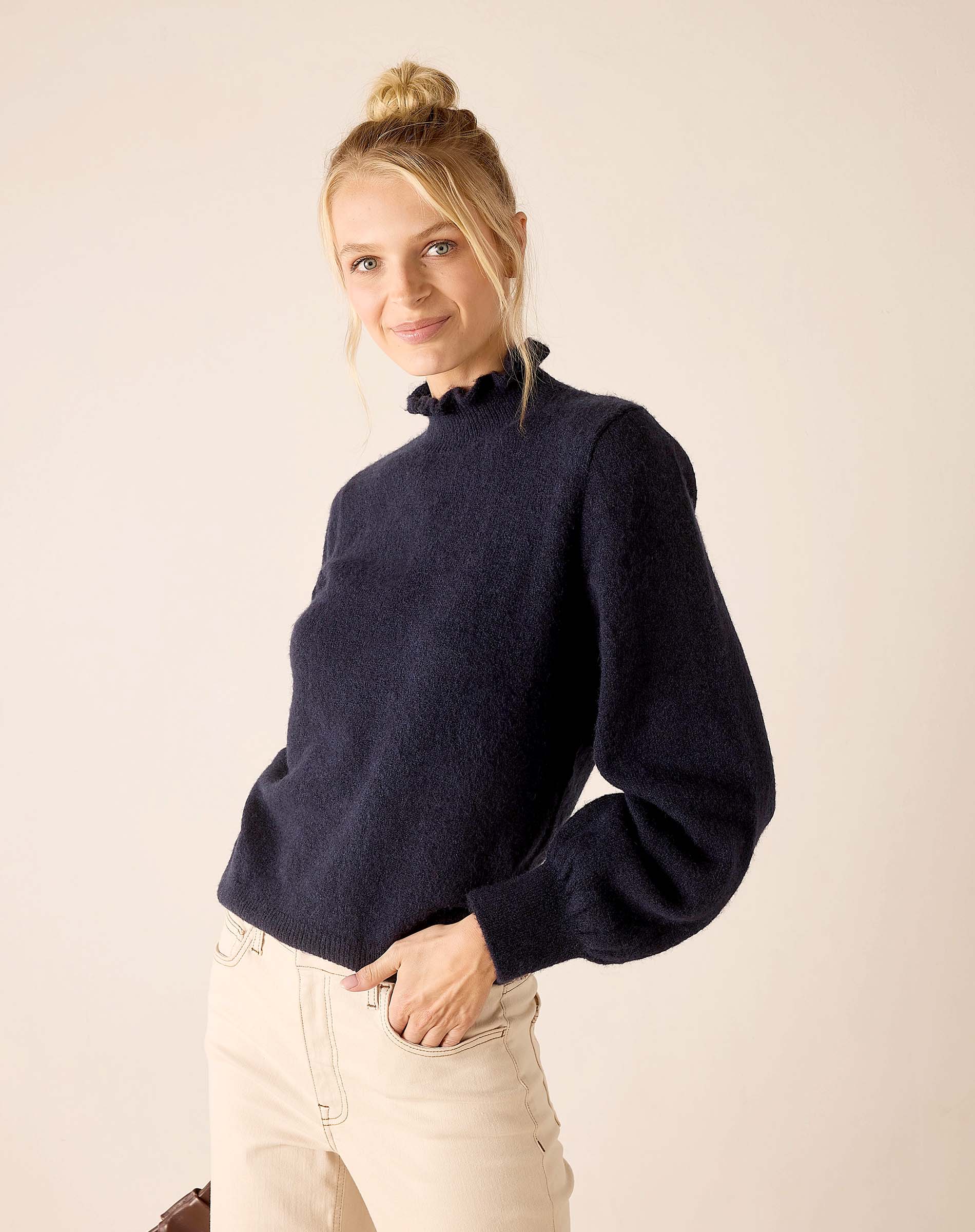Navy knit sweater with ruffled collar and balloon sleeves