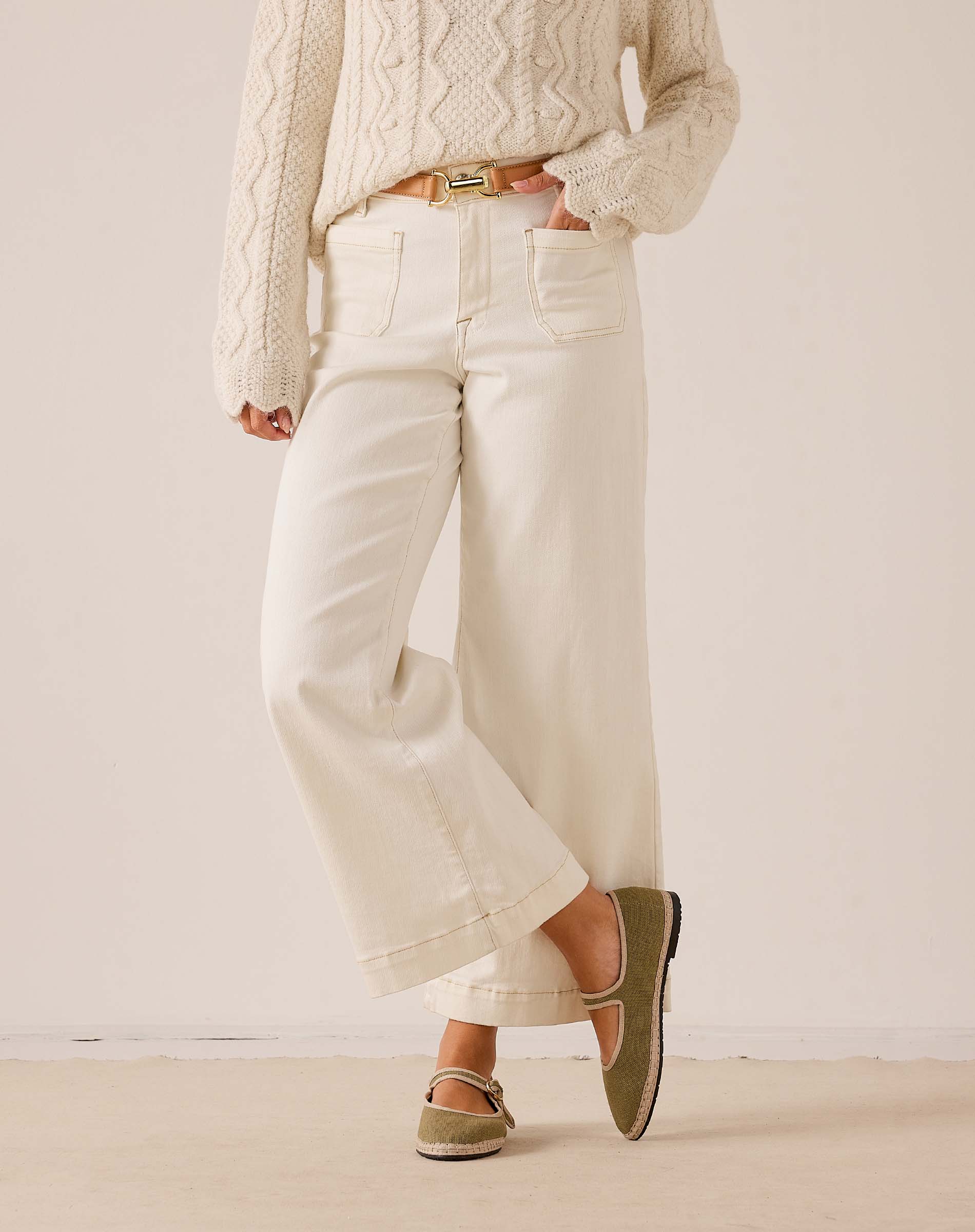 White sailor cropped wide-leg pants with front patch pockets and large cuffs.