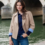 Classic khaki sailor peacoat with a button front and unique blue striped trim on the cuffs.