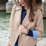 Classic khaki double-breasted sailor peacoat with wide lapels and gold buttons.
