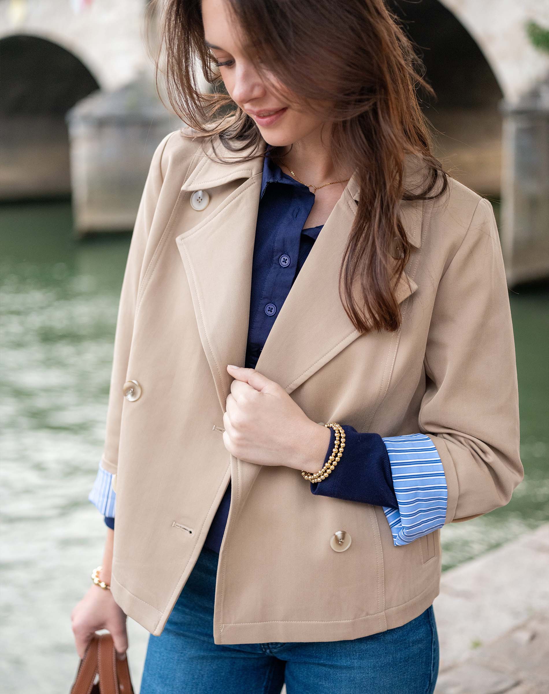 Classic khaki double-breasted sailor peacoat with wide lapels and gold buttons.