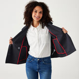 female wearing navy twill peacoat over a white collared shirt with blue jeans on a white background
