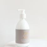 saltaire shea lotion laying on a white background