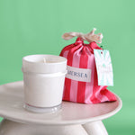 cabana flower sandbag candle with green backdrop