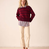 Pino red and dark brown horizontal stripe cashmere knit sweater with a round neckline.