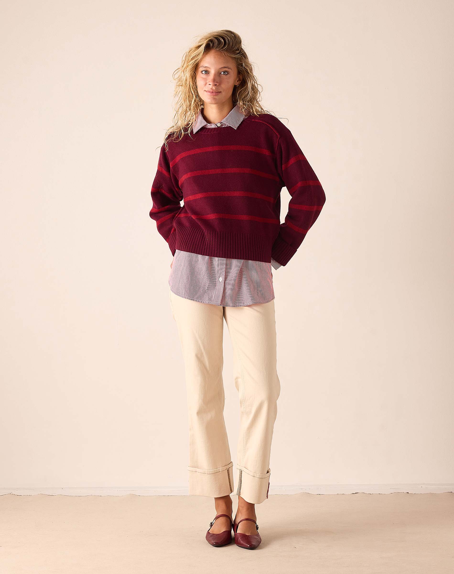 Pino red and dark brown horizontal stripe cashmere knit sweater with a round neckline.