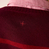Pino red knit cashmere sweater with a horizontal stripe and embroidered star detail.