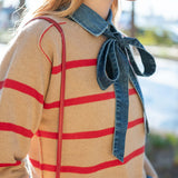Cappuccino and crimson striped knit sweater with a denim collar detail.