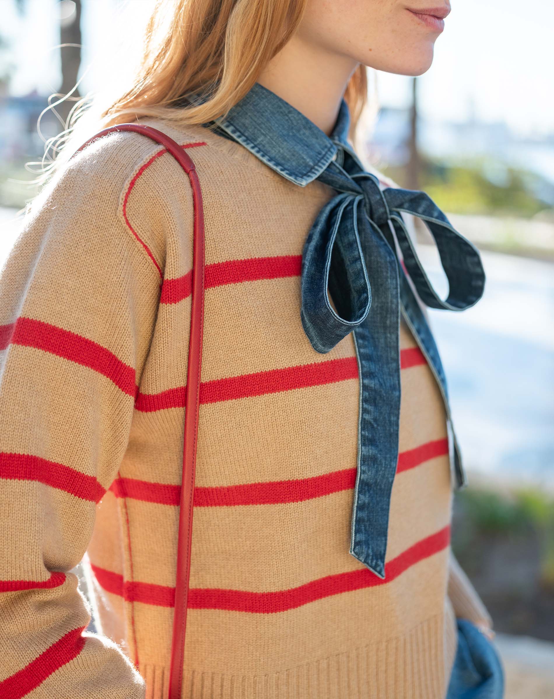 Cappuccino and crimson striped knit sweater with a denim collar detail.