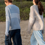 Women's travel-friendly soft sky white knit sweater featuring horizontal stripes and a relaxed fit.