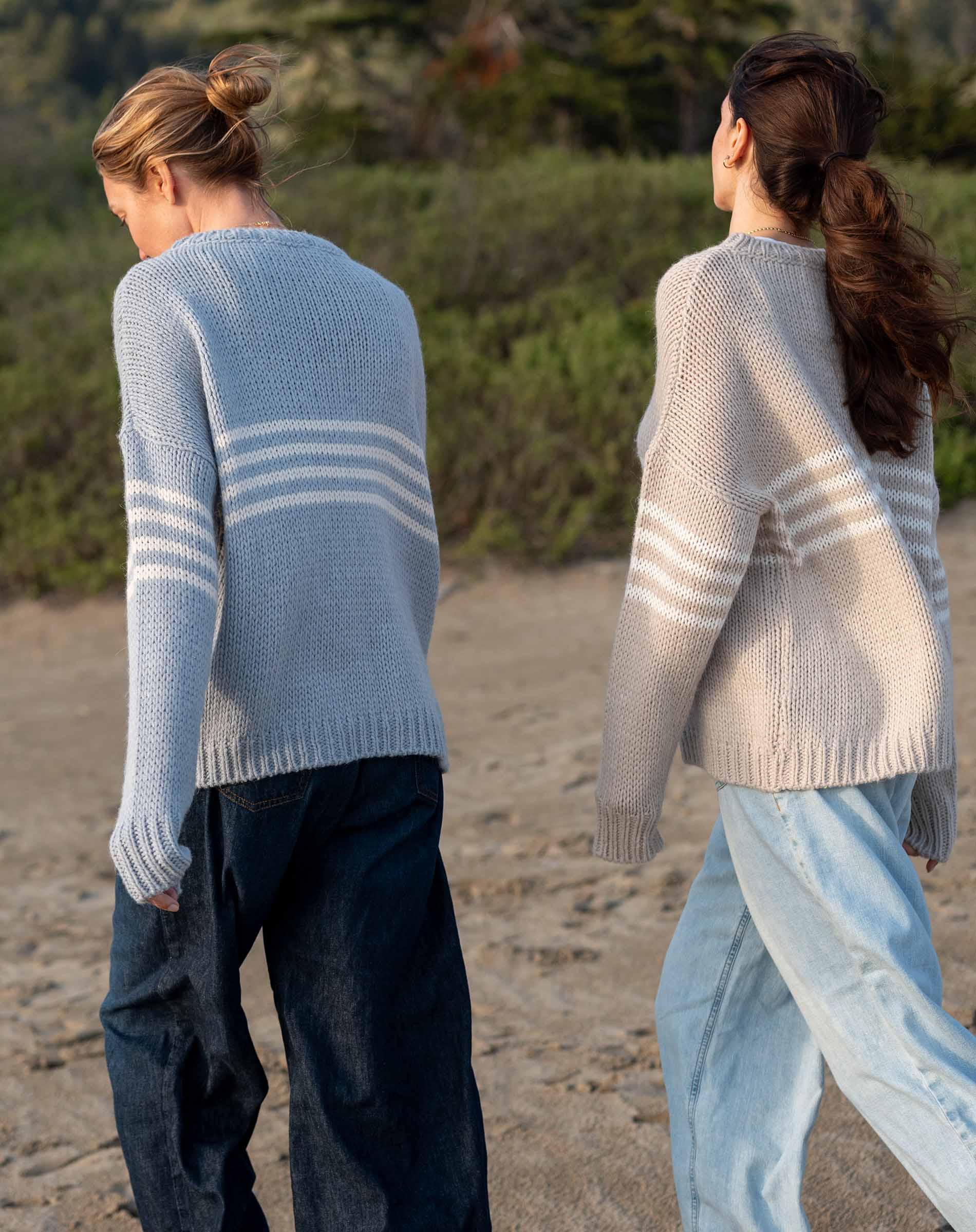 Women's travel-friendly soft sky white knit sweater featuring horizontal stripes and a relaxed fit.