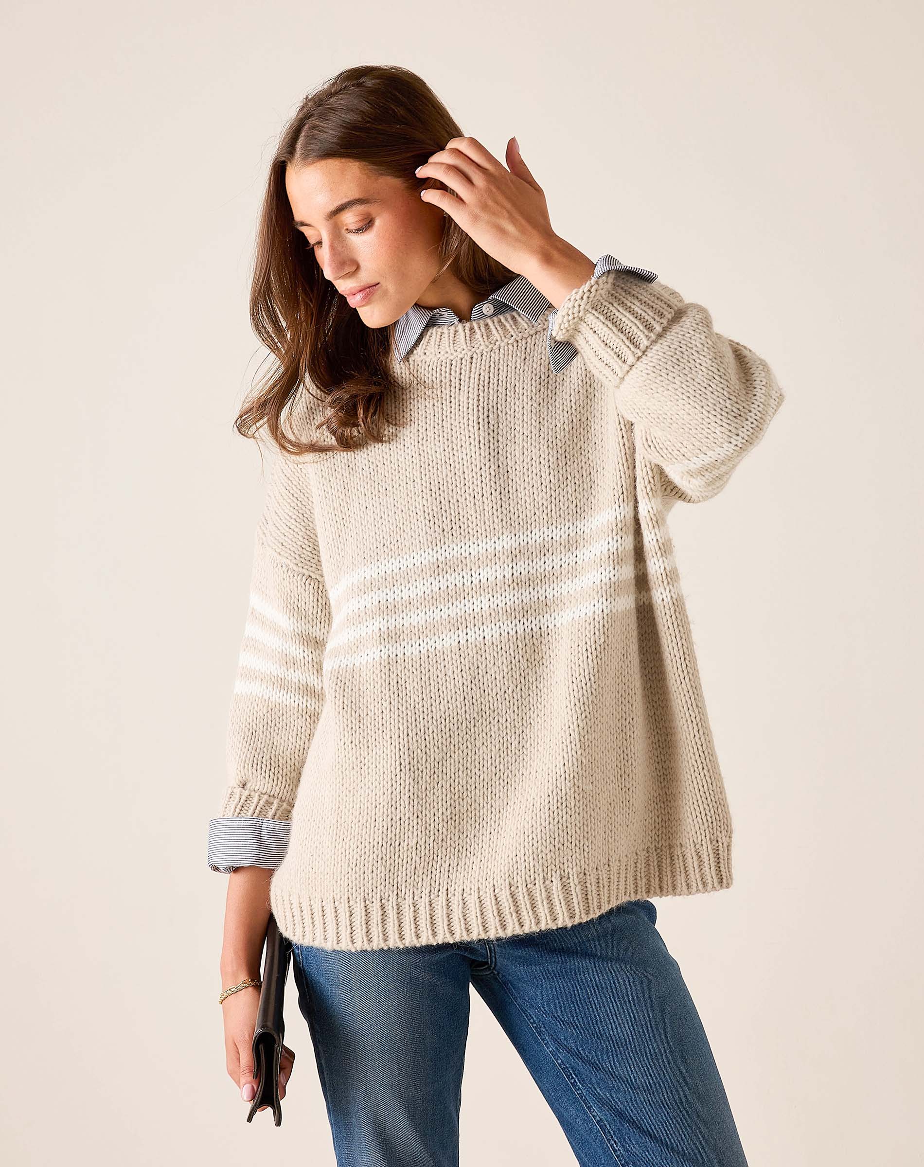 Women's travel-friendly taupe and white striped knit sweater with wide sleeves and a relaxed fit.