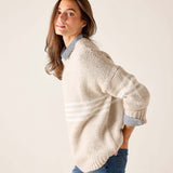 Taupe and white horizontal stripe knit sweater with a relaxed fit and wide ribbed cuffs.