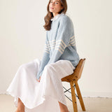 Soft sky white and yellow horizontal striped knit sweater with a decorative ruffled collar.