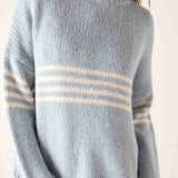 Soft sky white knit sweater with horizontal stripes in a light blue and cream palette.