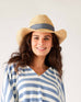 woman smiling wearing mersea seagrove straw hat 