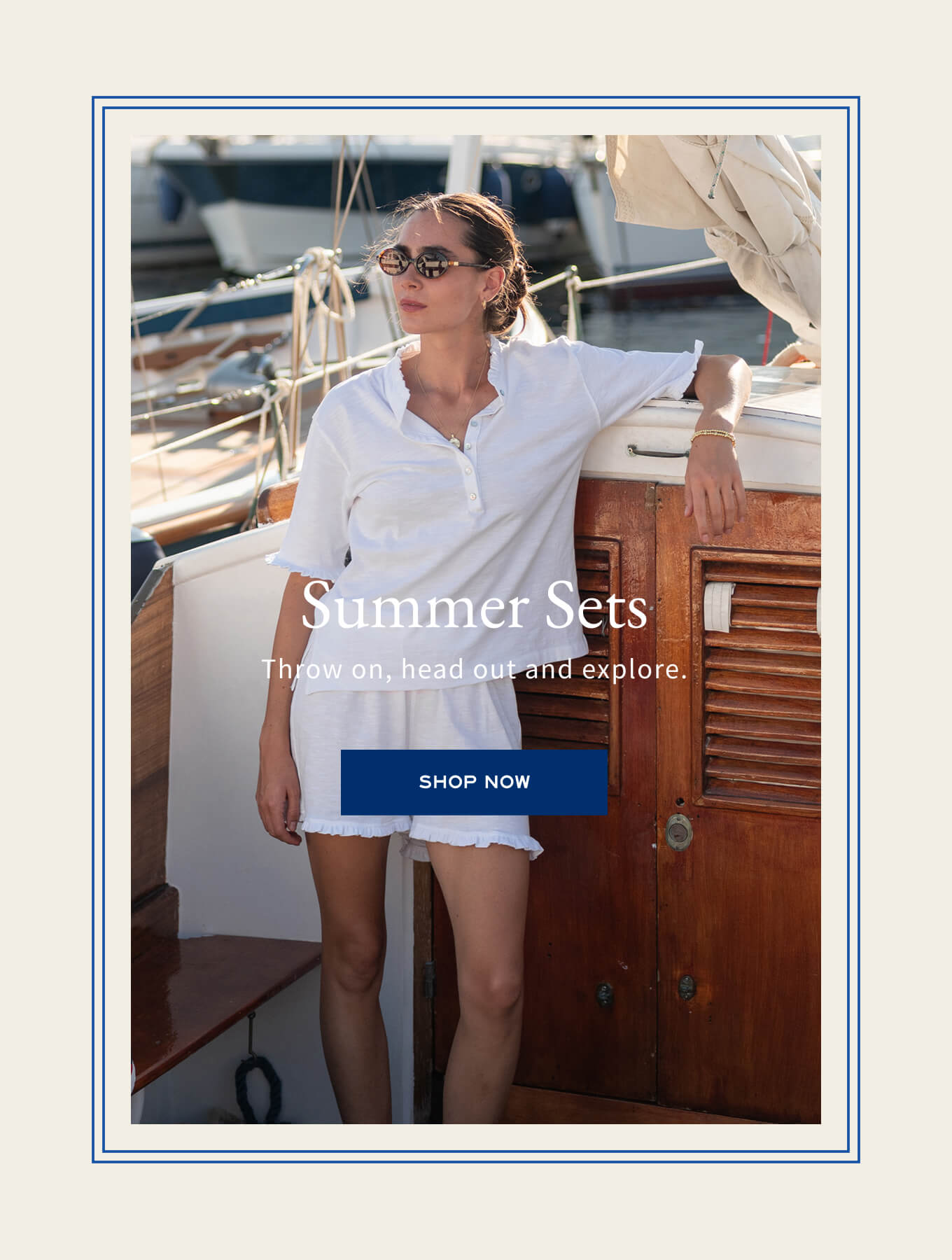 Woman in white outfit on a boat with 'Summer Sets' text and 'Shop Now' button.