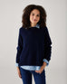 woman showcasing  mersea sol mate crewneck pullover in navy