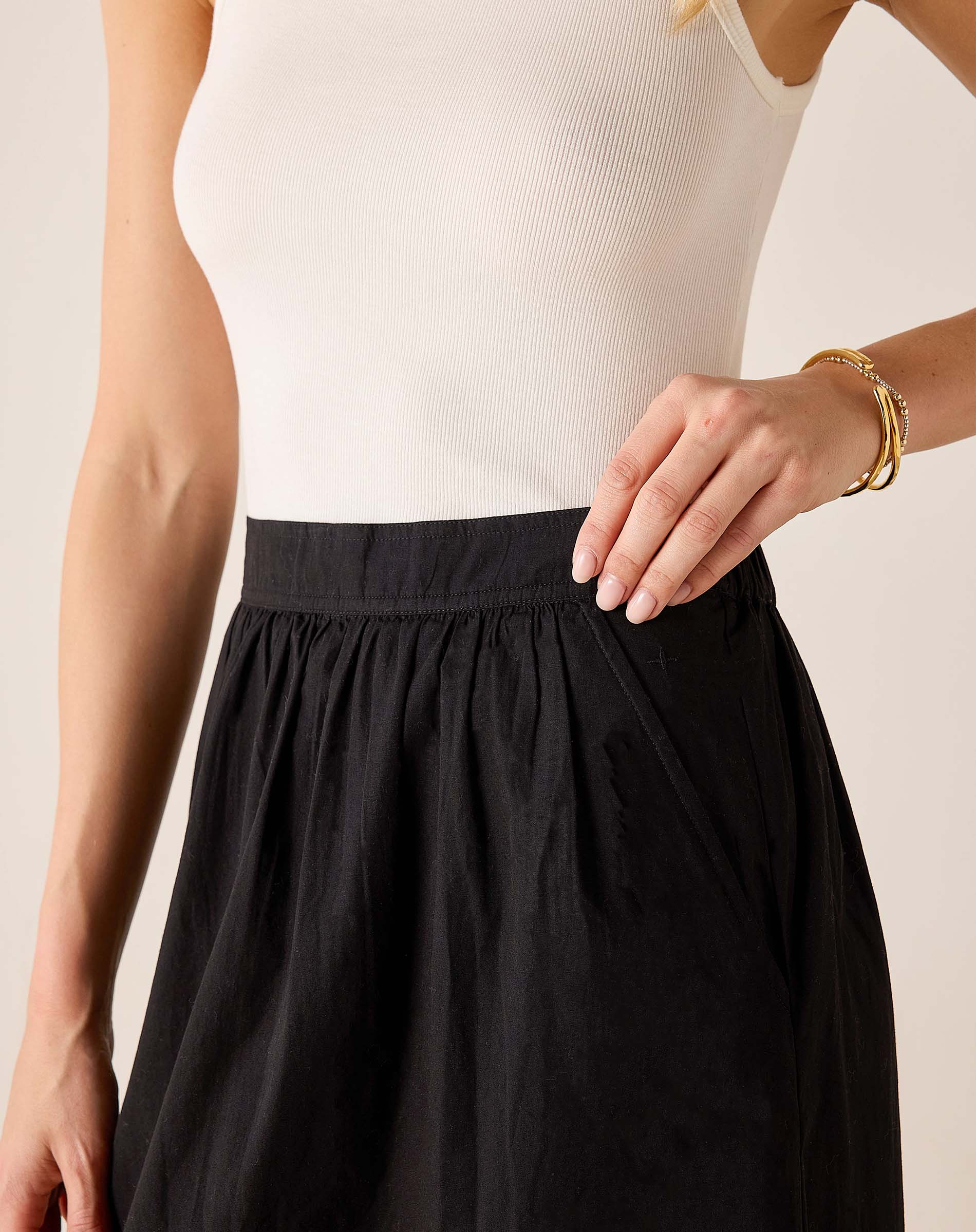 Black relaxed-fit gathered maxi skirt in lightweight fabric.