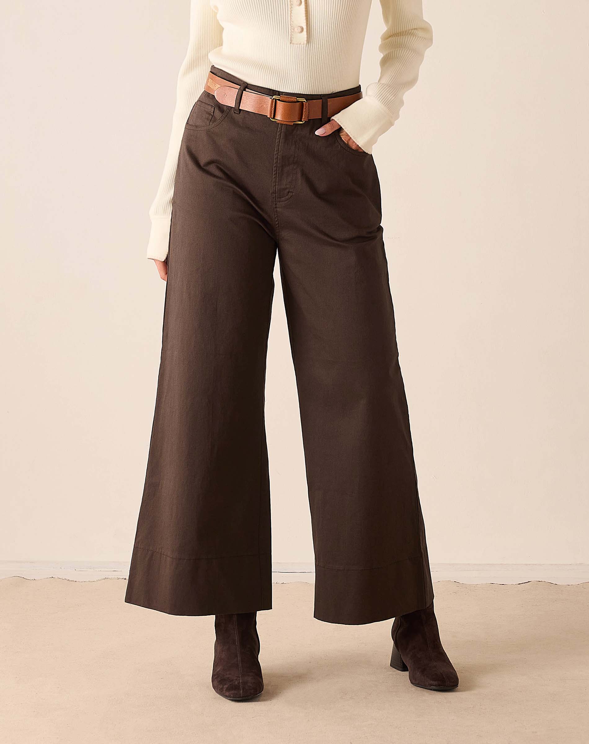 Espresso brown wide-leg woven cotton pants with a belt.