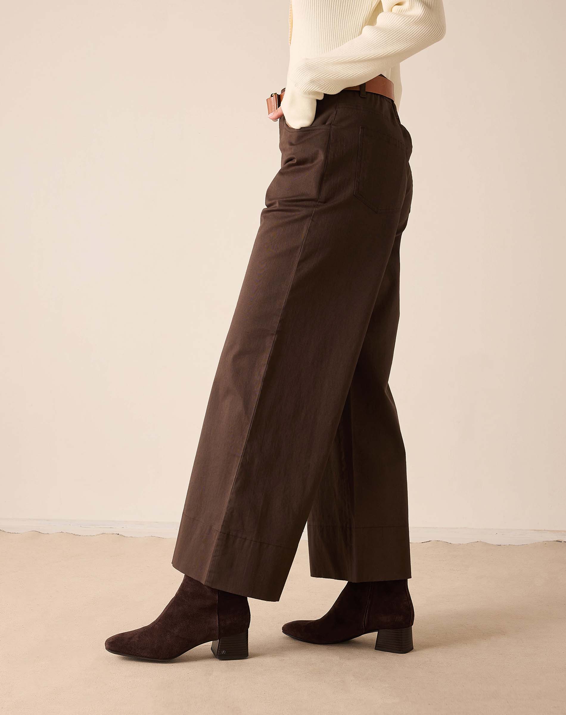 Espresso brown wide-leg trousers in a smooth woven fabric with front pockets.