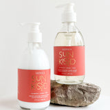 sun kissed liquid hand soap and shea lotion laying on a white background