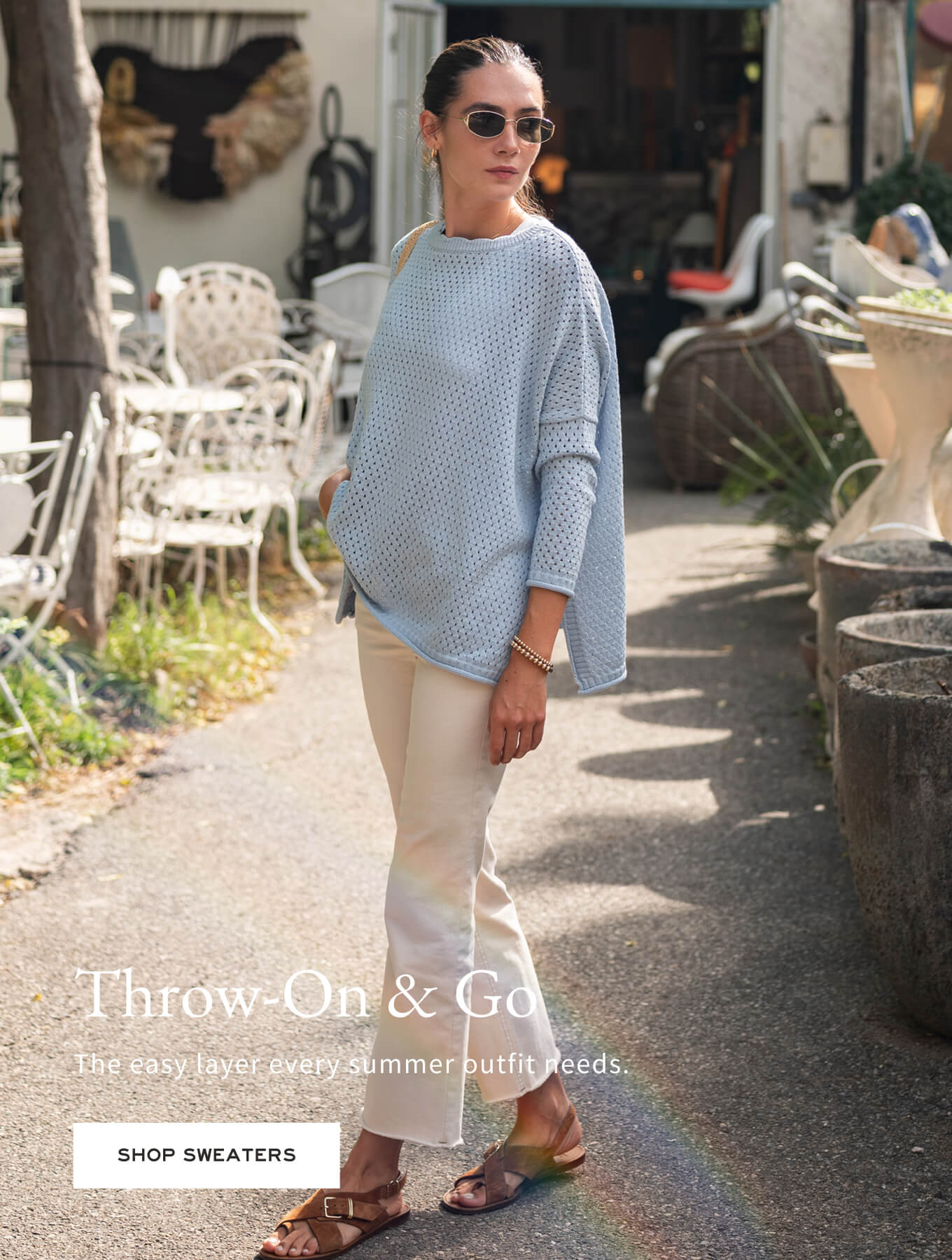 Woman wearing a light blue sweater and beige pants in an outdoor setting with text overlay.