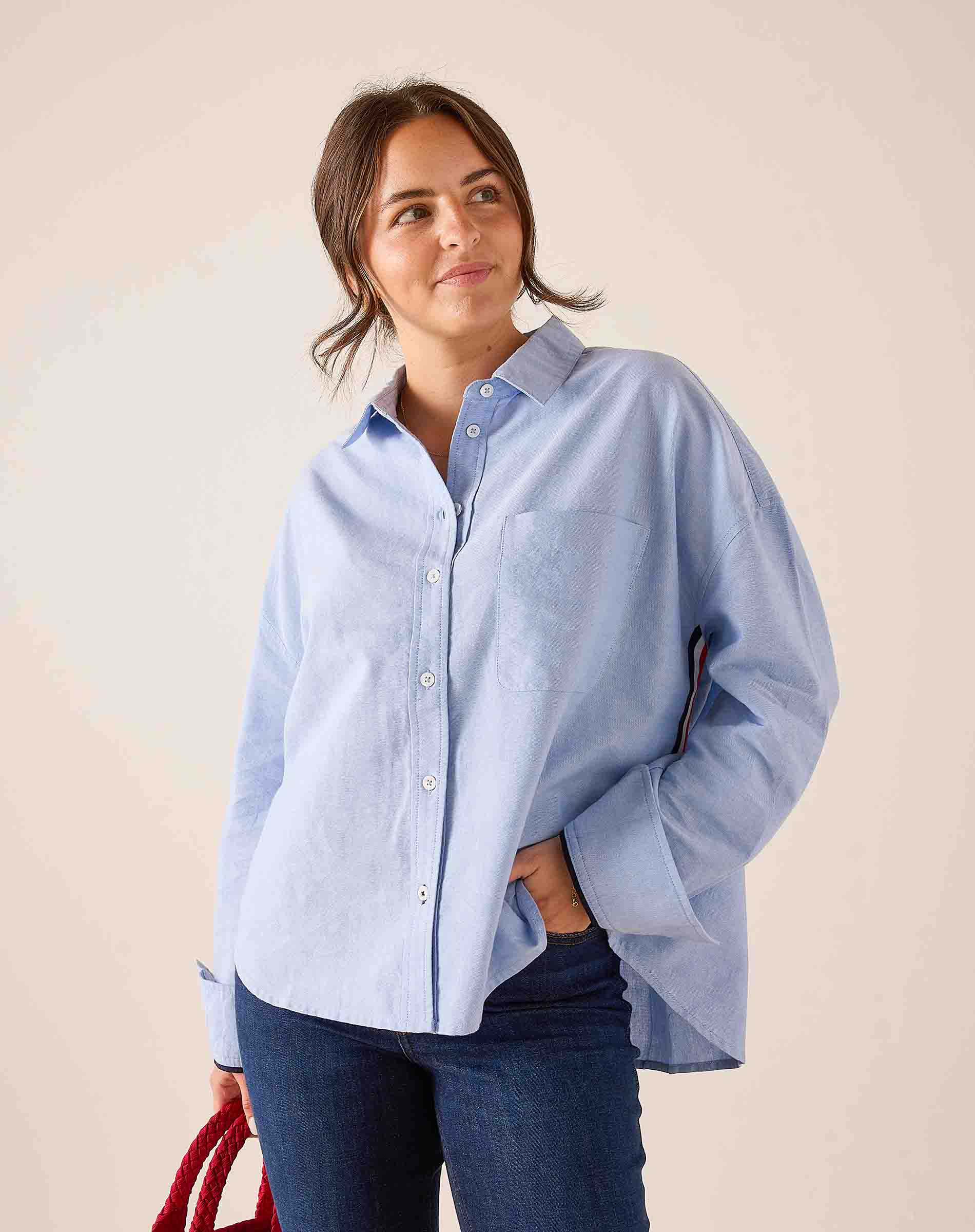 Oxford blue cotton button-down shirt with a relaxed fit and pointed collar.