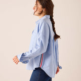 Oxford blue oversized button-up shirt with a navy and red stripe detail on the back