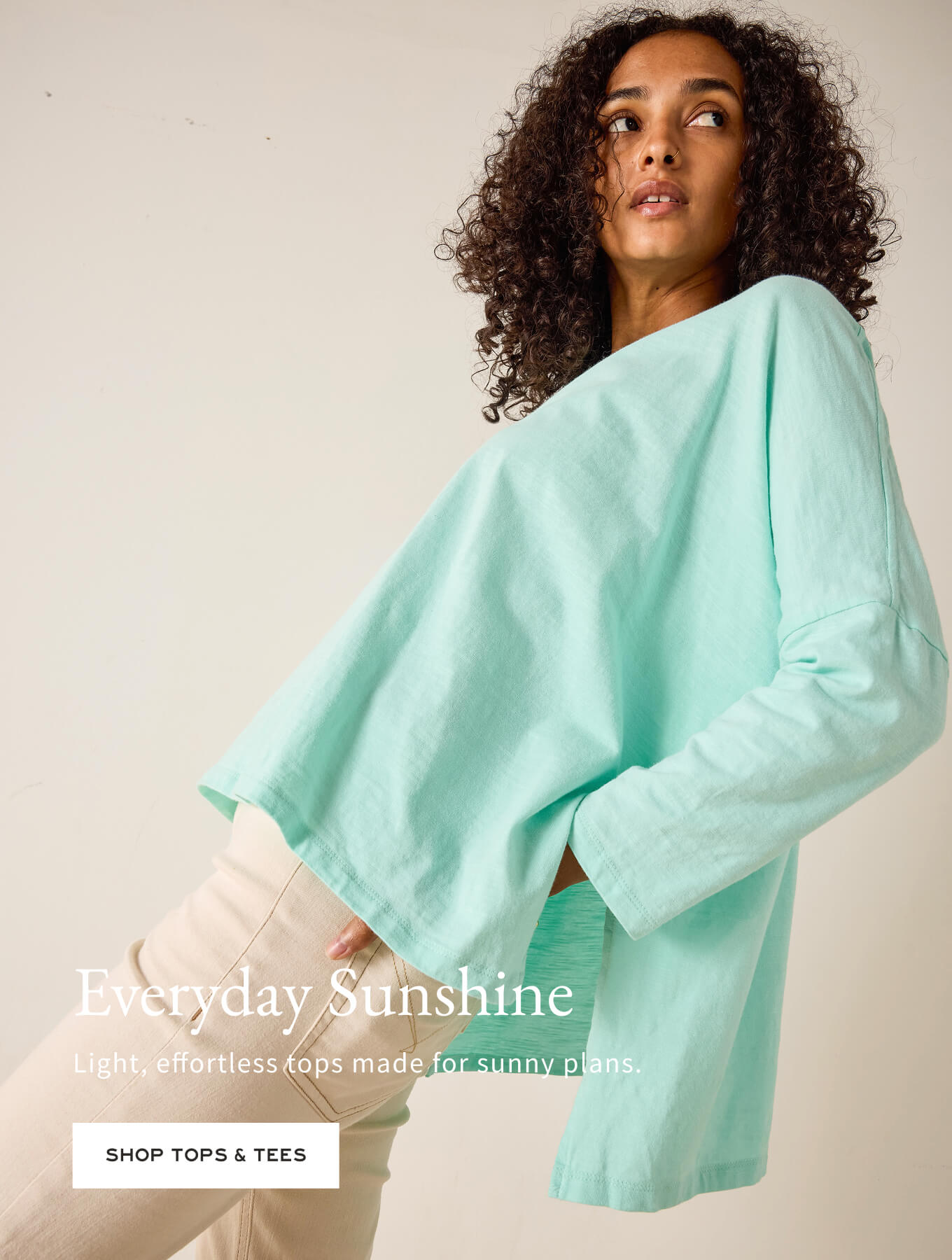 Woman wearing a light blue top with text overlay on a beige background