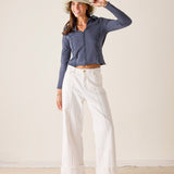 Women's travel-friendly atlas blue quarter-zip polo tee in a soft knit fabric.