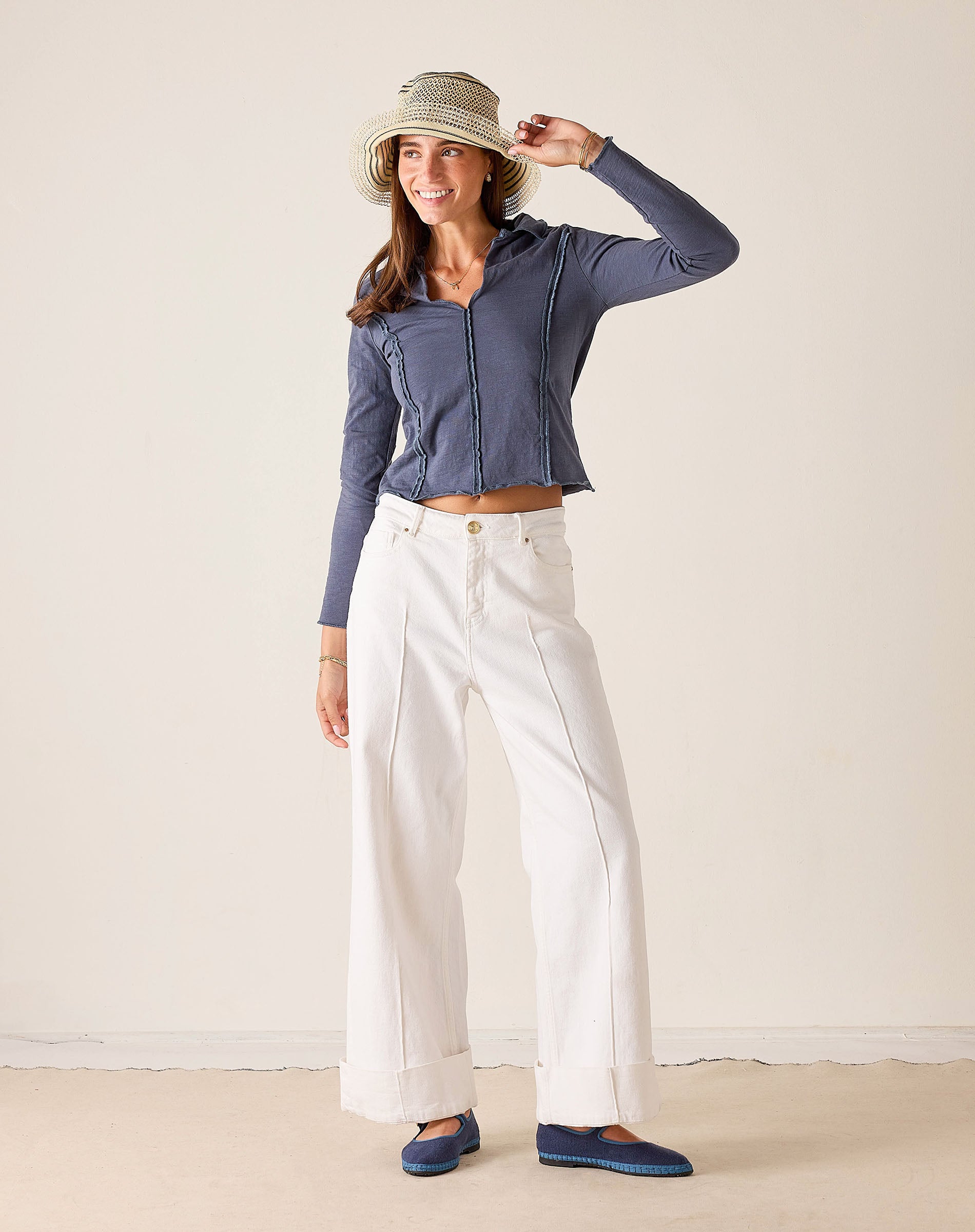 Women's travel-friendly atlas blue quarter-zip polo tee in a soft knit fabric.