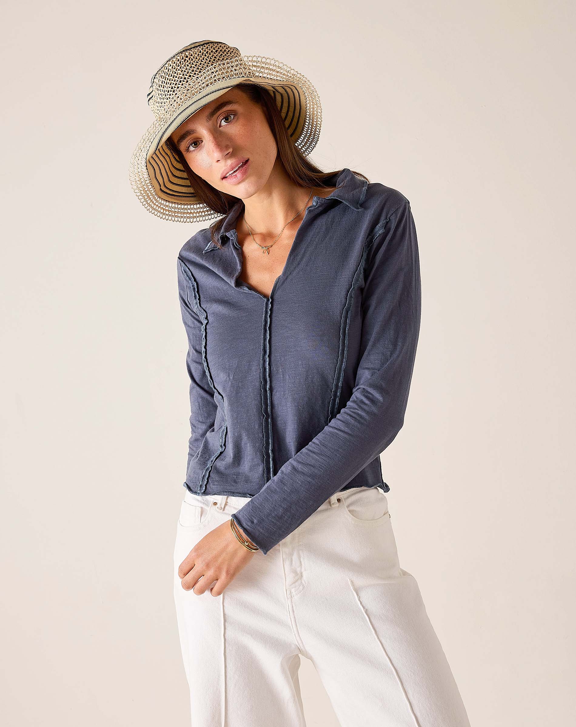 Atlas blue tailored long sleeve polo tee in a soft knit fabric.