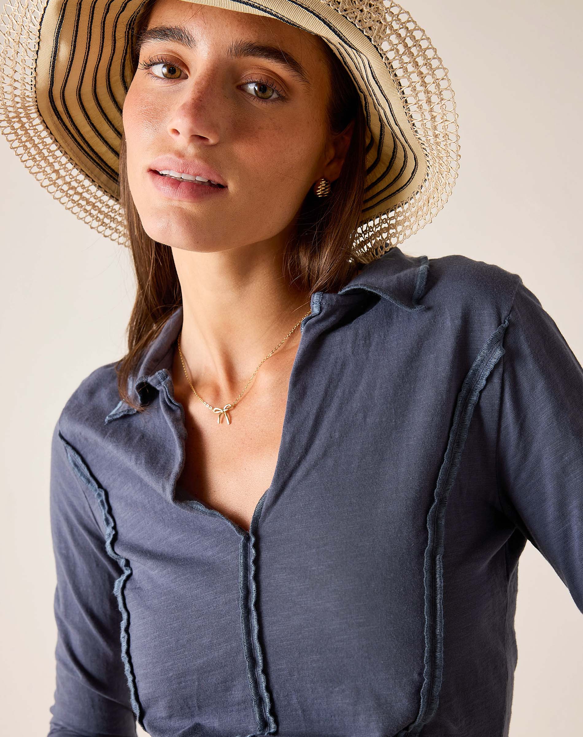 Atlas blue linen blend polo tee with ruffle detailing and buttoned placket