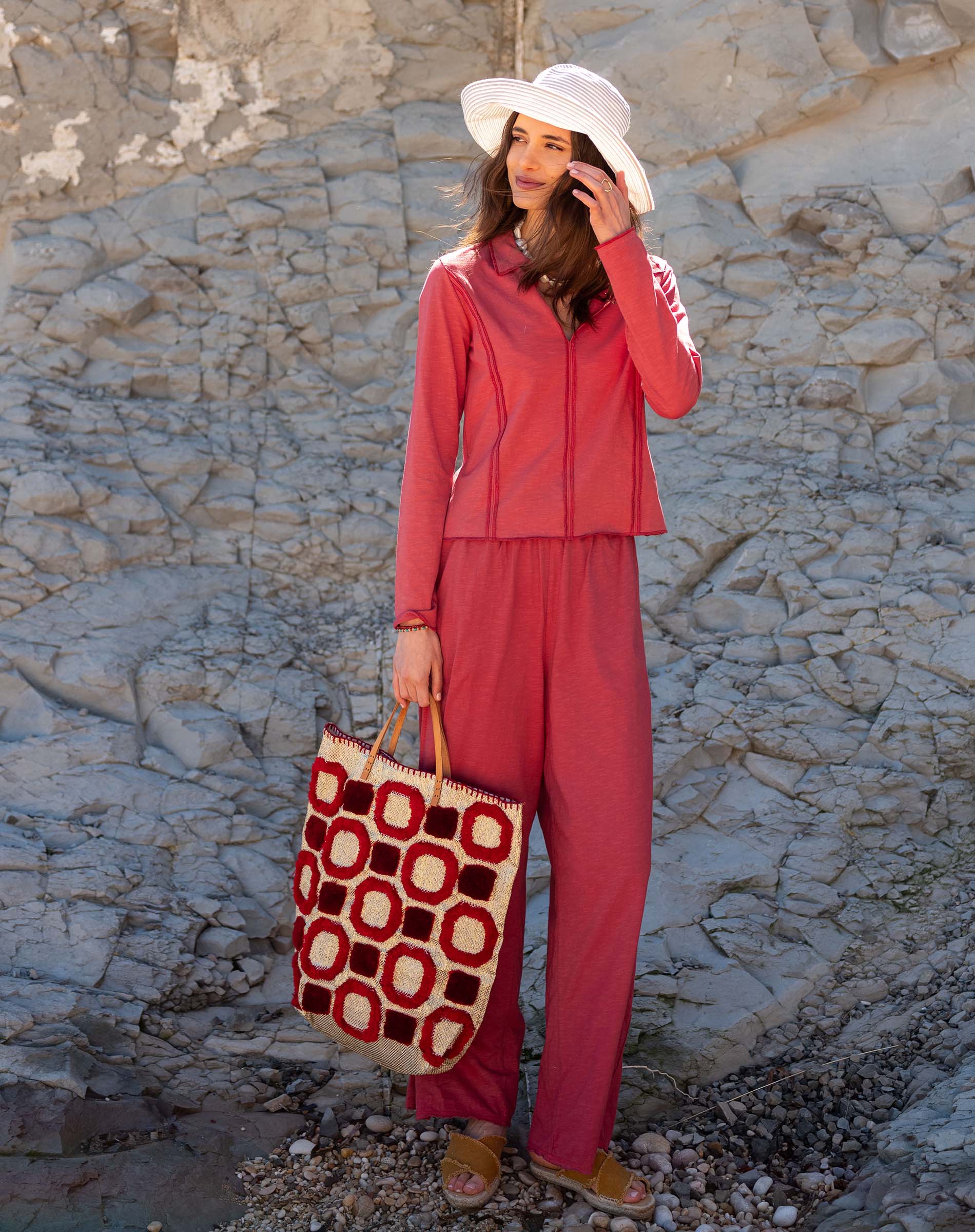 Women's travel-friendly cayenne red zip-up knit polo shirt and matching lounge pants set.
