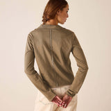 Back view of women's travel-friendly nutmeg polo tee.