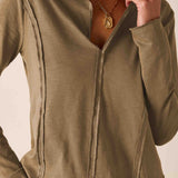 Nutmeg ribbed knit polo tee with a buttoned collar and vertical stitching details.