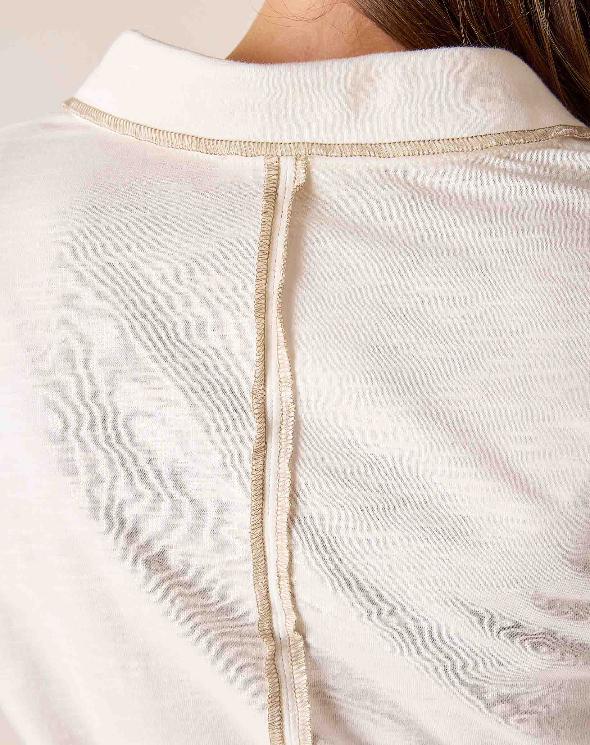 White cotton blend knit polo tee with a contrast trim and buttoned placket.
