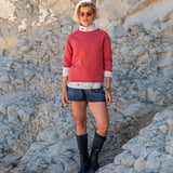 Cayenne red raglan tee with white stripes on the sleeves and collar.